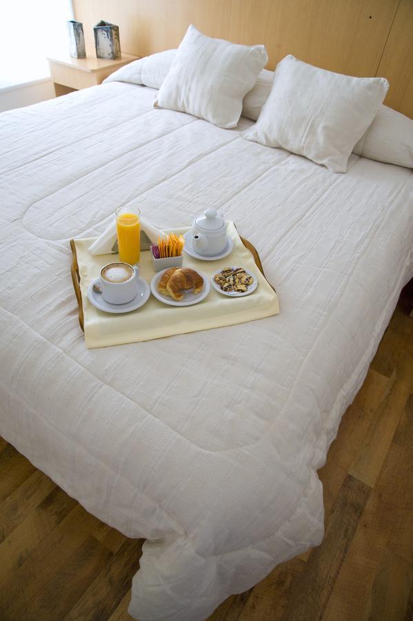 Global Hotel Centenario Bagian luar foto